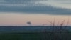 Un nor de fum ce se ridică deasupra localității Nowosiolki, Polonia, în apropiere de granița cu Ucraina, 15 noiembrie 2022.