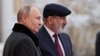 Russia - President Vladimir Putin greets Armenian Prime Minister Nikol Pashinian during a CIS summit in St. Petersburg, December 26, 2023.