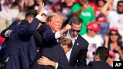 Former U.S. President Donald Trump was rushed from the stage at the campaign rally in Pennsylvania by Secret Service agents on July 13.