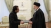 Iranian President Ebrahim Raisi (right) meets with Pakistani Ambassador to Iran Muhammad Mudassir Tipu in Tehran on January 27.