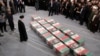 Iran's supreme leader, Ayatollah Ali Khamenei, looks at the coffins of members of the IRGC who were killed in the air strike in Damascus during a funeral ceremony in Tehran on April 4.