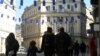 Sarajevo, Bosnia and Herzegovina -- European flags hanging over the main street as people pass by