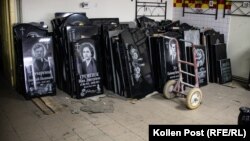 Gravestones are displayed at Volodymyr Cherdakov's workshop near Yatseve cemetery on the outskirts of Chernihiv in January.