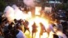Armenia - A police stun grenade explodes during a rally against Prime Minister Nikol Pashinian in Yerevan, June 12, 2024.