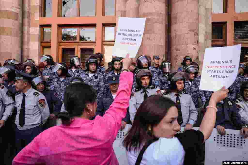 Armenian demonstrators hold placards demanding the resignation of Armenian Prime Minister Nikol Pashinian in Yerevan on September 21. Nagorno-Karabakh is internationally recognized as part of Azerbaijan and is currently populated by around 120,000 ethnic Armenians. It broke from Baku's hold in a war as the Soviet Union collapsed. It survived for decades with direct support from Armenia thanks to control of a land link known as the Lachin Corridor.