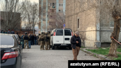 The two wounded men were among three who Armenia's Interior Ministry said attempted to break into the administrative building of the Nor Nork police precinct of Yerevan on March 24.