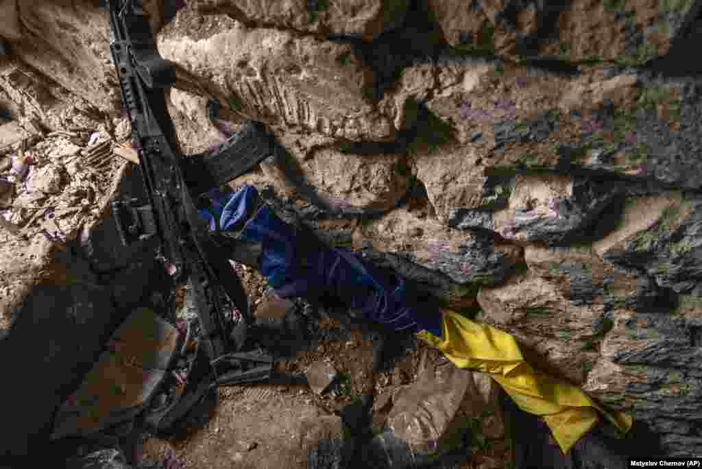 A Ukrainian flag and a rifle in a bunker near Andriyivka. Ukrainian President Volodymyr Zelenskiy is making his country's case to Washington and to the world this week for more money and more weapons and must persuade his audience that the counteroffensive is working. The U.S. Congress is currently weighing President Joe Biden’s request to provide as much as $24 billion more in military and humanitarian aid.