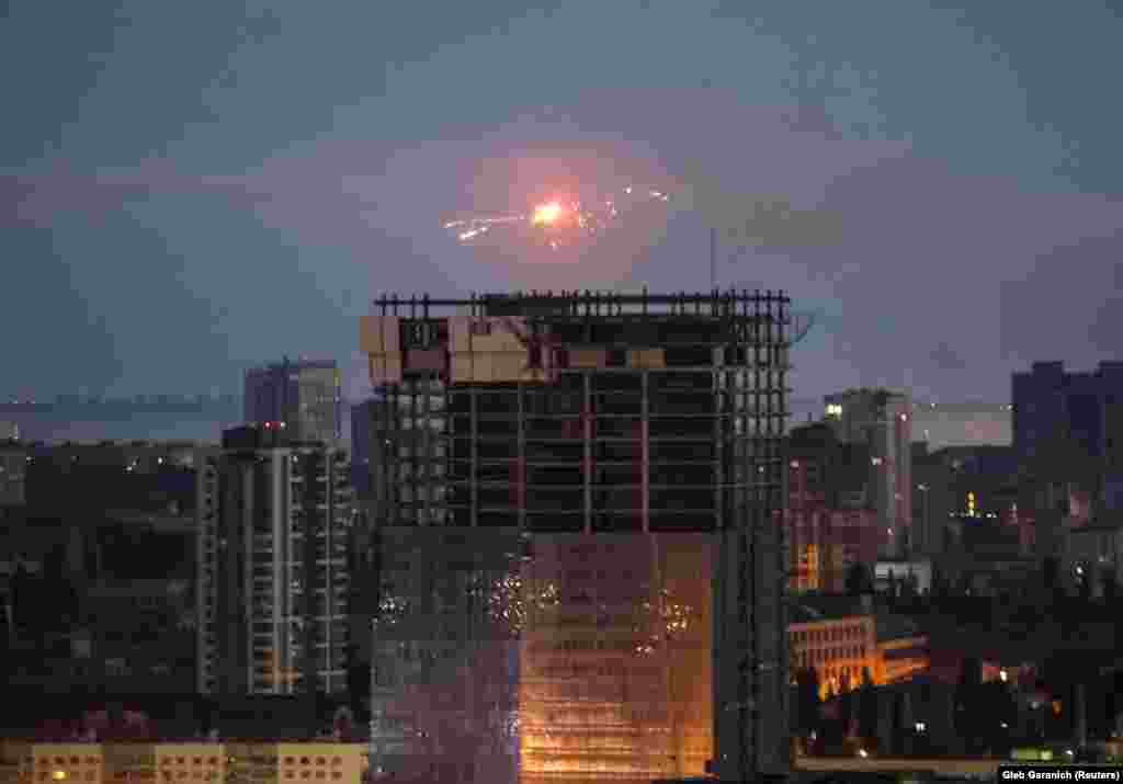 Loud explosions were seen in the sky over Kyiv as dawn was breaking. Ukrainian national grid operator Ukrenergo said that the Russian missile strikes damaged energy infrastructure in central and western Ukraine, causing five regions to be without electricity.