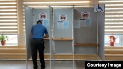 A man casts his ballot in a constitutional referendum in Uzbekistan on April 30.