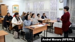 Residents of Moldova's pro-Moscow Gagauzia region attend a Romanian-language class.