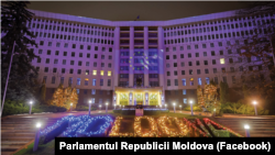 Moldova's parliament building lit up in the European Union colors on December 12, 2023.