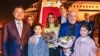 Brazilian President Luiz Inacio Lula da Silva holds flowers next to First Lady Rosangela "Janja" da Silva and China's vice minister of foreign affairs, Xie Feng in Shanghai on April 13.