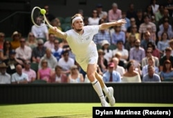 Kazakhstan's Alexander Bublik in action during his fourth round match against Russia's Andrey Rublev at Wimbledon on July 9.