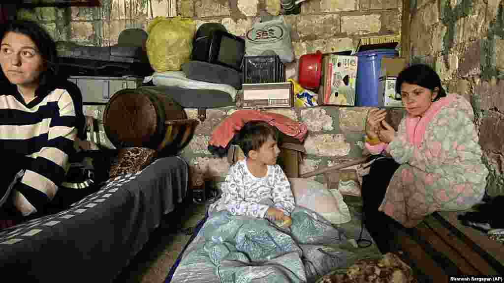Children sit in a shelter during shelling in Stepanakert, the provincial capital of Azerbaijan's breakaway region of Nagorno-Karabakh, on September 20. Azerbaijan declared that it had started what it called an "anti-terrorist operation" targeting Armenian military positions in Nagorno-Karabakh, where local ethnic Armenian officials reported heavy shelling. Armenian Prime Minister Nikol Pashinian said, in a shot at Baku's justification for its offensive, that Yerevan "does not have an army" in Nagorno-Karabakh.