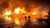 Firefighters work at a port compound on the Danube River damaged by a Russian drone strike in Ukraine's Odesa region in October.