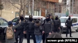 Police in the Azerbaijani capital, Baku, during a raid of the Toplum TV offices on March 6.