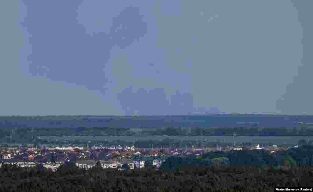 Smoke rises above Shebekino, as seen from the city of Belgorod on June 7. Russian journalist Igor Yakovenko told Current Time that Russian President Vladimir Putin "is not in control of the situation in the Belgorod region." He added that, amid the rise of competing armed factions, "we are talking about the birth of unrest in Russia." 
