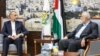 Iranian Foreign Minister Hossein Amirabdollahian (left) meets with the leader of the Palestinian militant group Hamas, Ismail Haniyeh, in Doha on October 13. 