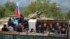 Nagorno-Karabakh - Ethnic Armenian flee Karabakh for Armenia through the Lachin checkpoint controlled by Russian peackeepers and Azeri border guards, September 26, 2023. 