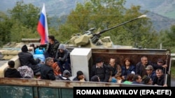 Nagorno-Karabakh - Ethnic Armenian flee Karabakh for Armenia through the Lachin checkpoint controlled by Russian peackeepers and Azeri border guards, September 26, 2023. 