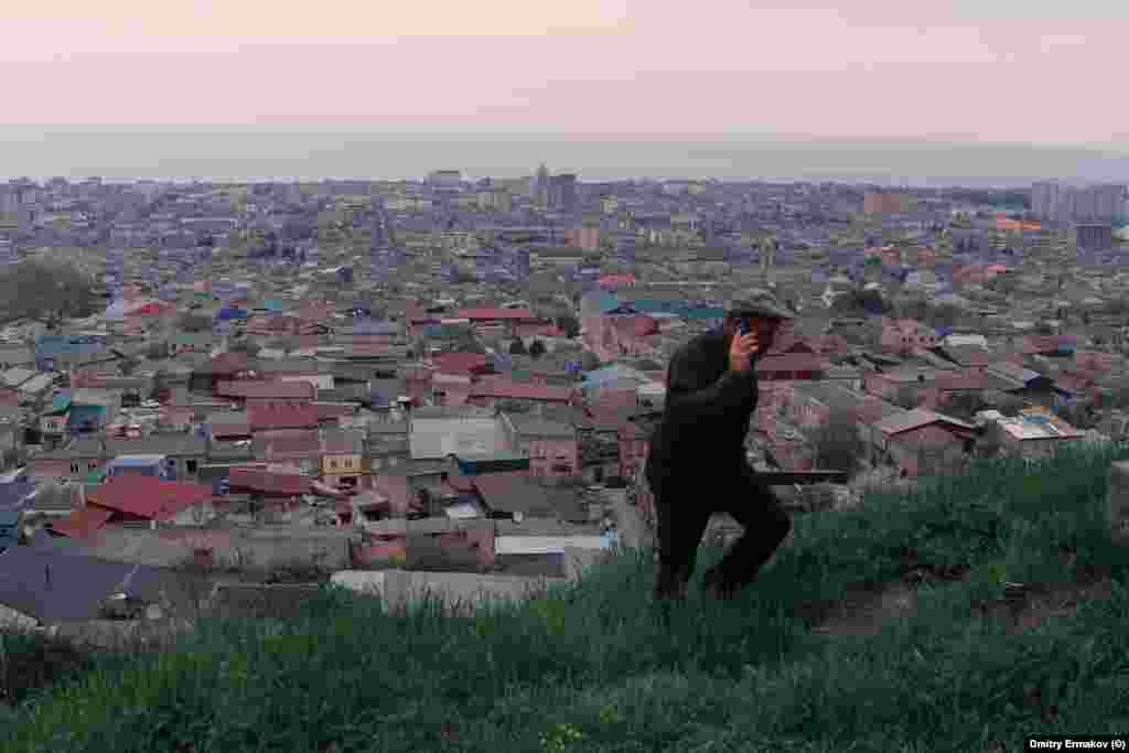A man climbs a hill overlooking Derbent. After the October 29 airport violence, Rabbi Isakov told a local media outlet, “The situation is very difficult in Daghestan, the community is very afraid,” and added, “It’s not clear where to flee to." 