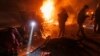 Ukrainian first responders work at the scene of an overnight drone attack in Kharkiv on April 4. Air defenses are an increasing priority for Kyiv.