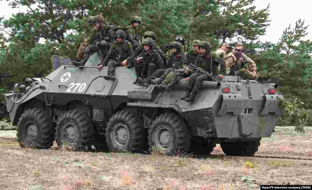 Belarusian soldiers and Wagner fighters on an armored vehicle at a training ground in Belarus's Brest region. In a post on the Belarus Defense Ministry's Telegram channel, a soldier was quoted as saying that Wagner fighters, "constantly show us new tricks and share their experiences from combat operations. There isn't much time for rest but this experience is very cool and we need it," the unnamed soldier said. 