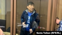 Marat Zhylanbaev appears in court in Astana on October 30.