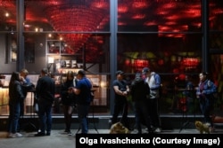 People gather to socialize in central Kharkiv amid frequent Russian strikes.