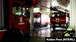Firetrucks at the main Kharkiv station as an air alert sounds outside