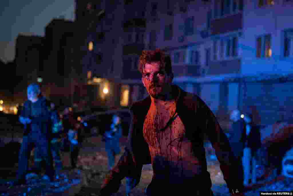 An injured man stands next to an apartment building that was damaged during the massive Russian drone strike on Kyiv. "One person died. In total, four victims were hospitalized in the Holosiyivskiy district. Medics provided help on the spot," Klitschko wrote, adding that 20 people were evacuated.