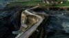 Sanski Most, coal mine, A man rides a bicycle on the edge of the abyss
