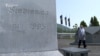 Potocari, Srebrenica, Bosnia and Herzegovina, Fadila Efendic approaches her son's and husband's grave 