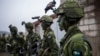 Войници от шведски батальон за контраразузнаване участват във военно учение в Кунгсанген, близо до Стокхолм, 27 февруари 2024 г.