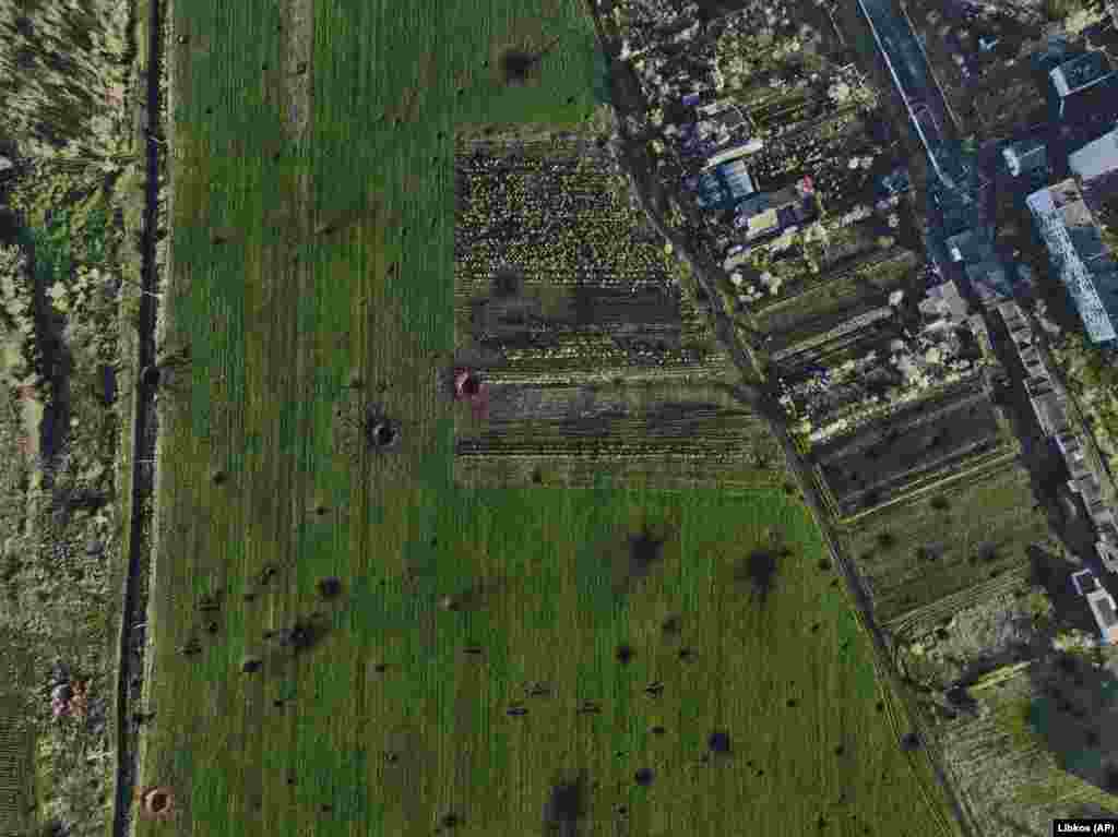 The cratered landscape of a Bakhmut field. Serhiy Cherevatiy, spokesman for Ukraine's eastern forces, said on April 26 that Russian forces had attacked 324 times using artillery and multiple rocket launchers within the past 24 hours. 
