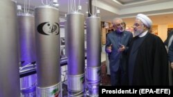 Iranian President Hassan Rohani (right) inspects a nuclear facility in Tehran earlier this year.