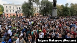 People attend a rally to demand authorities allow opposition candidates to run in the upcoming local election and release protesters who were detained during recent demonstrations in Moscow on August 31.