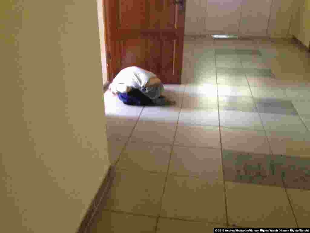 A boy writhes on the floor of a state orphanage for children with disabilities in the Sverdlovsk region.
