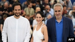 Iranian-Danish director Ali Abbasi, Iranian actress Zar Amir Ebrahimi, and Iranian actor Mehdi Bajestani pose during a photo call for the film Holy Spider at Cannes Film Festival on May 23, 2022. Ebrahimi took home the Best Actress award for her role.