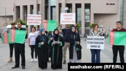 Turkmen citizens protest against their treatment by the Turkish authorities outside in Istanbul on June 21.