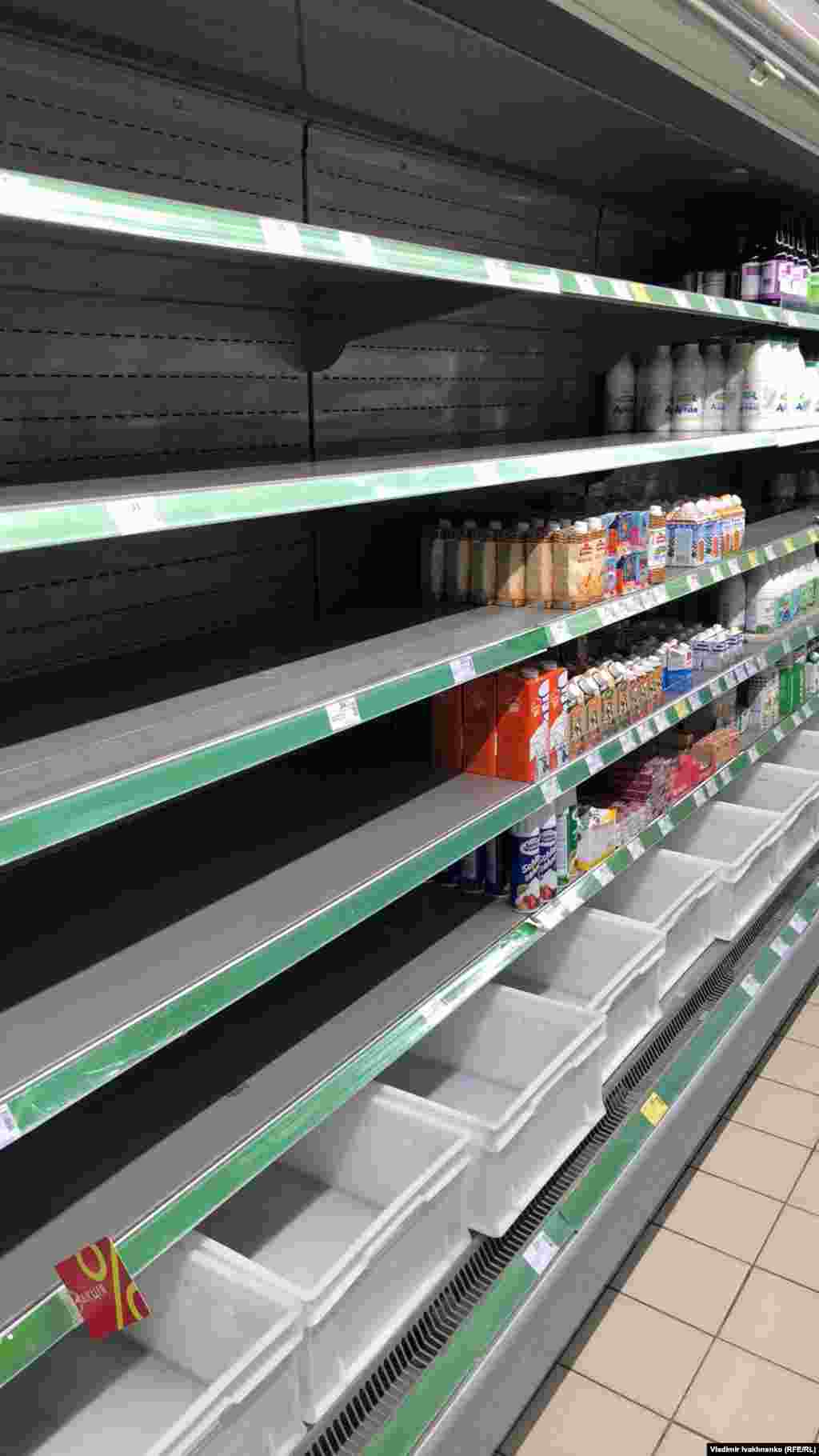 Empty shelves in a Kyiv supermarket.
