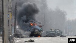 Горящая техника на улицах украинского города Харьков