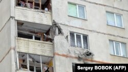 Наслідки обстрілу житлового будинку в Харкові, 26 лютго 2022 року