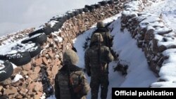 Armenian soldiers take up positions on the border with Azerbaijan.