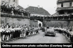 Children applaud Ceausescu’s motorcade in Sibiu, in 1967.