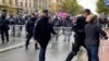 The police remove the girl in front of the cordon in Belgrade