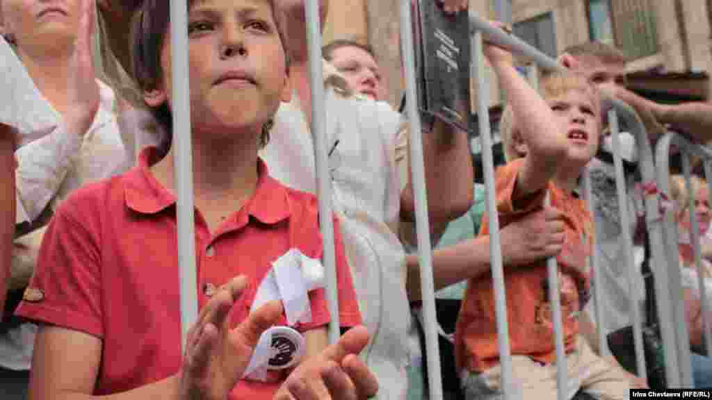 Young protesters wore white ribbons, a symbol of Russia's pro-democracy movement.