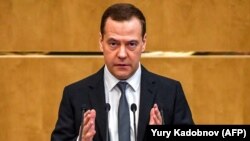 Russian Prime Minister Dmitry Medvedev delivers a speech in the State Duma in Moscow on April 11: "We will not forget."