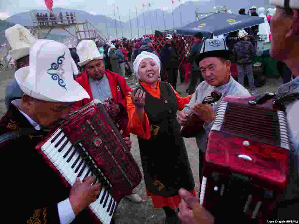 Nazira Ivanova rehearses with her bandmates before taking the stage at an event for traditional music. The song, which stopped several passersby in their tracks, was "about love," she told RFE/RL. 