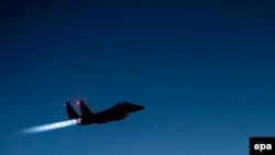 A handout picture from the U.S. Defense in September 2014 shows a U.S. Air Force F-15E Strike Eagle flying over northern Iraq early in the morning of September 23, after conducting air strikes against Islamic State targets in Syria.